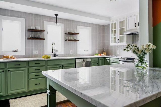 kitchen with stainless steel appliances, under cabinet range hood, green cabinets, and open shelves