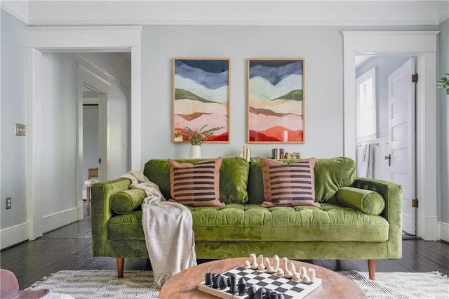 living room with baseboards and wood finished floors