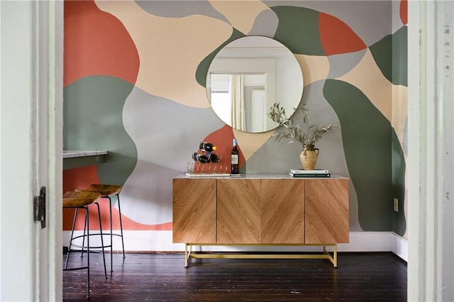 room details with baseboards and wood finished floors