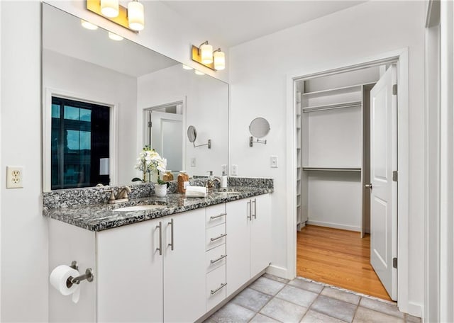 923 Peachtree St NE Unit 1238, Atlanta, GA 30309 - bathroom with double vanity and stone finish floors