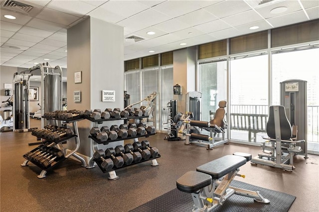 923 Peachtree St NE Unit 1238, Atlanta, GA 30309 - gym with a paneled ceiling and expansive windows