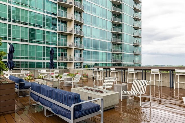 923 Peachtree St NE Unit 1238, Atlanta, GA 30309 - wooden terrace with an outdoor fire pit