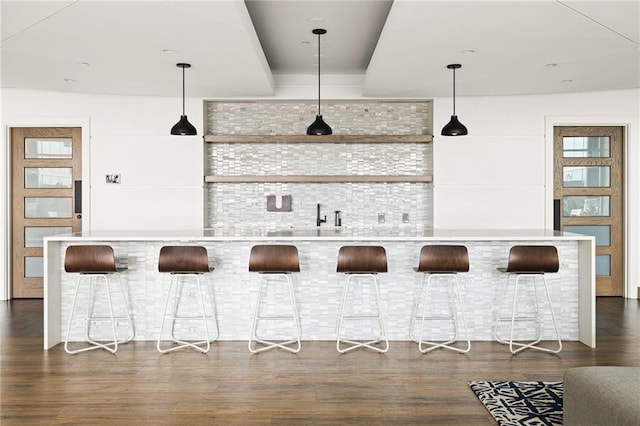 923 Peachtree St NE Unit 1238, Atlanta, GA 30309 - bar area with dark wood finished floors and decorative light fixtures