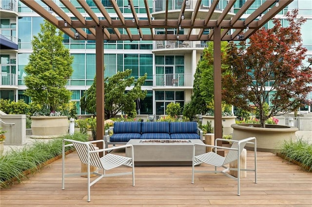 923 Peachtree St NE Unit 1238, Atlanta, GA 30309 - wooden terrace with an outdoor living space with a fire pit and a pergola
