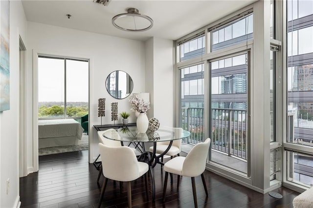 923 Peachtree St NE Unit 1238, Atlanta, GA 30309 - dining area with healthy amount of natural light and dark wood-style flooring