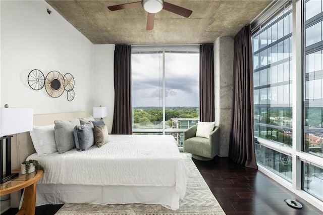 923 Peachtree St NE Unit 1238, Atlanta, GA 30309 - bedroom featuring dark wood-type flooring, floor to ceiling windows, and a ceiling fan