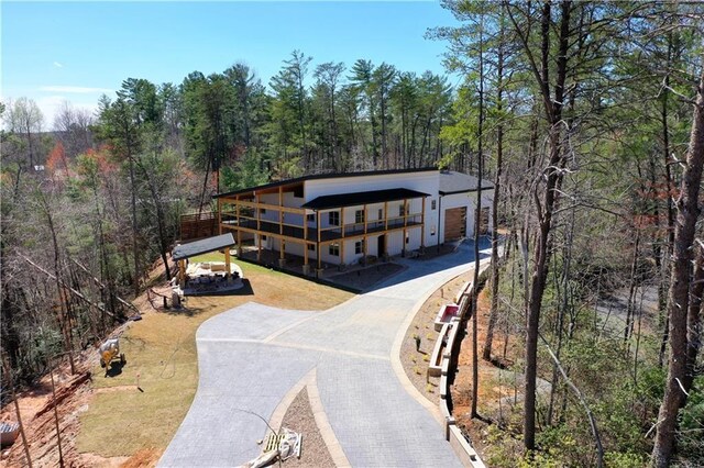 300 Mountain Ridge Dr, Dahlonega, GA 30533 - view of front of home with driveway and a forest view