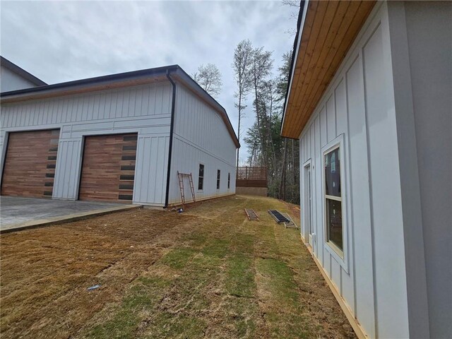 300 Mountain Ridge Dr, Dahlonega, GA 30533 - view of property exterior featuring a garage and a lawn