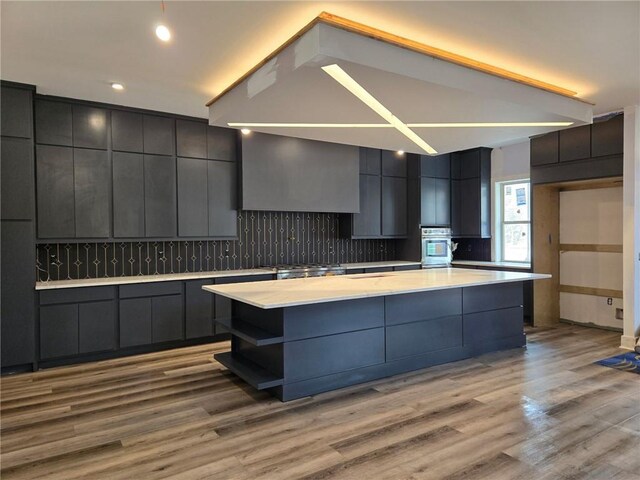 300 Mountain Ridge Dr, Dahlonega, GA 30533 - kitchen with a center island, modern cabinets, light countertops, and stainless steel oven