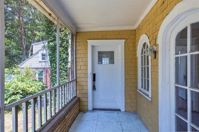 entrance to property with a balcony