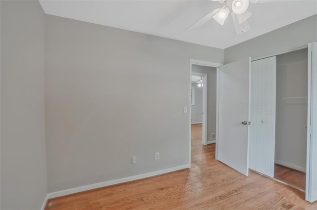 622 Sheffield Rd, Norcross, GA 30071 - unfurnished bedroom featuring light wood-style flooring, a closet, baseboards, and a ceiling fan
