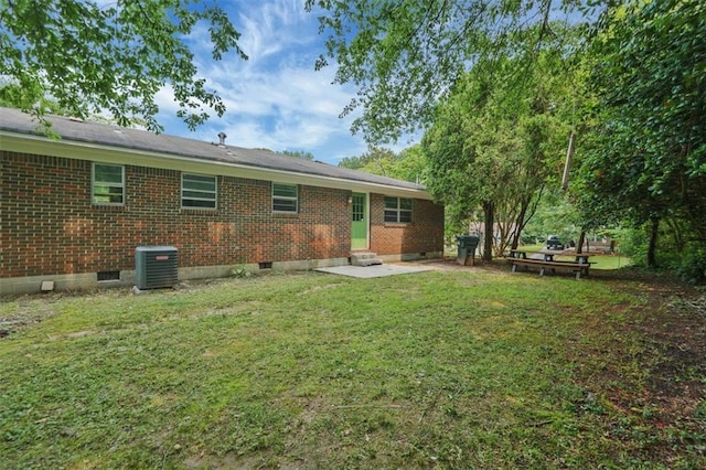 622 Sheffield Rd, Norcross, GA 30071 - rear view of property featuring brick siding, central AC, a yard, crawl space, and entry steps