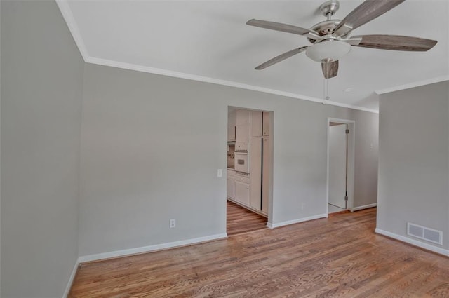 622 Sheffield Rd, Norcross, GA 30071 - empty room with ornamental molding, ceiling fan, baseboards, and wood finished floors