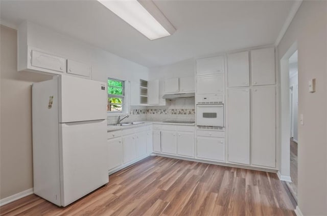 622 Sheffield Rd, Norcross, GA 30071 - kitchen featuring white appliances, white cabinets, light wood-type flooring, light countertops, and under cabinet range hood