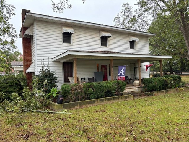 view of front facade featuring a porch and a front yard