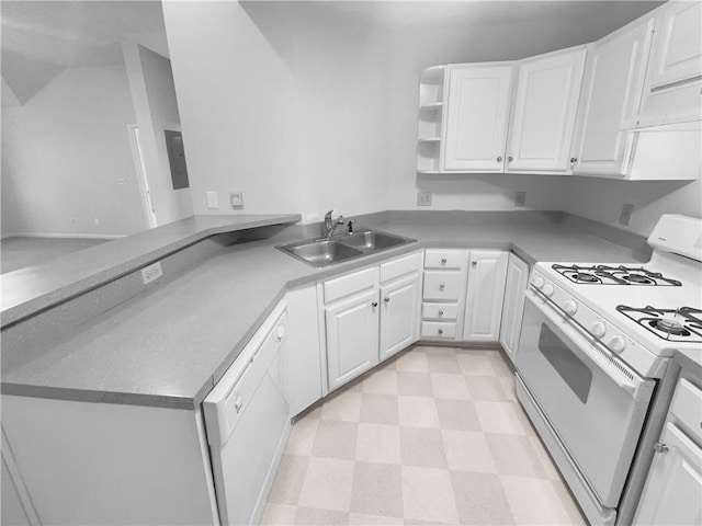 kitchen featuring kitchen peninsula, white cabinetry, sink, and white appliances