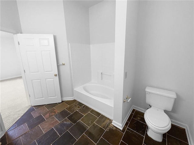 bathroom featuring toilet and tub / shower combination