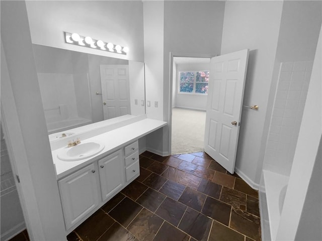 4279 Orchard Grv, Stone Mountain, GA 30083 - full bath with baseboards, vanity, and stone tile floors
