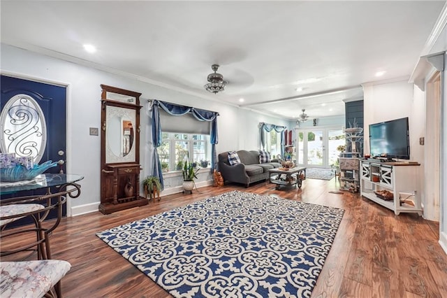 living room with ceiling fan, ornamental molding, and hardwood / wood-style flooring