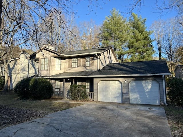 view of front facade with a porch and a garage