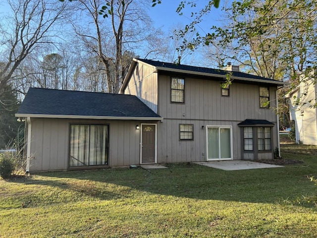 back of house featuring a yard and a patio