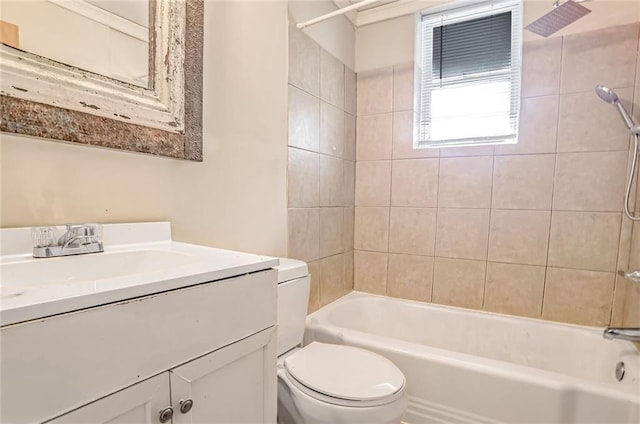 full bathroom featuring vanity, toilet, and tiled shower / bath