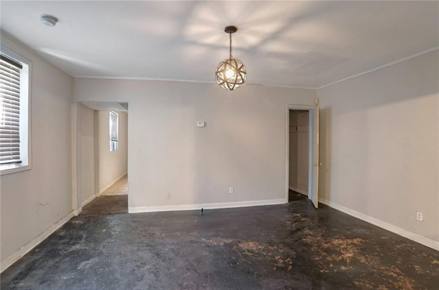 unfurnished room with crown molding and a healthy amount of sunlight