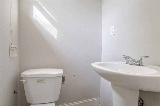 bathroom with toilet and sink