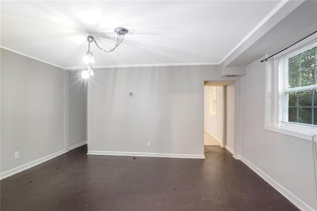 empty room featuring crown molding