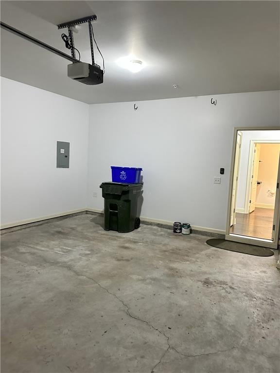 garage featuring a garage door opener and electric panel