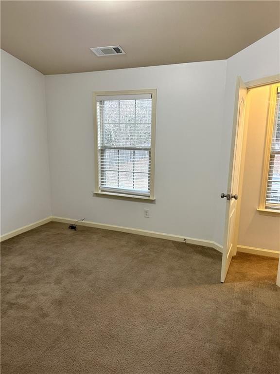 spare room with carpet