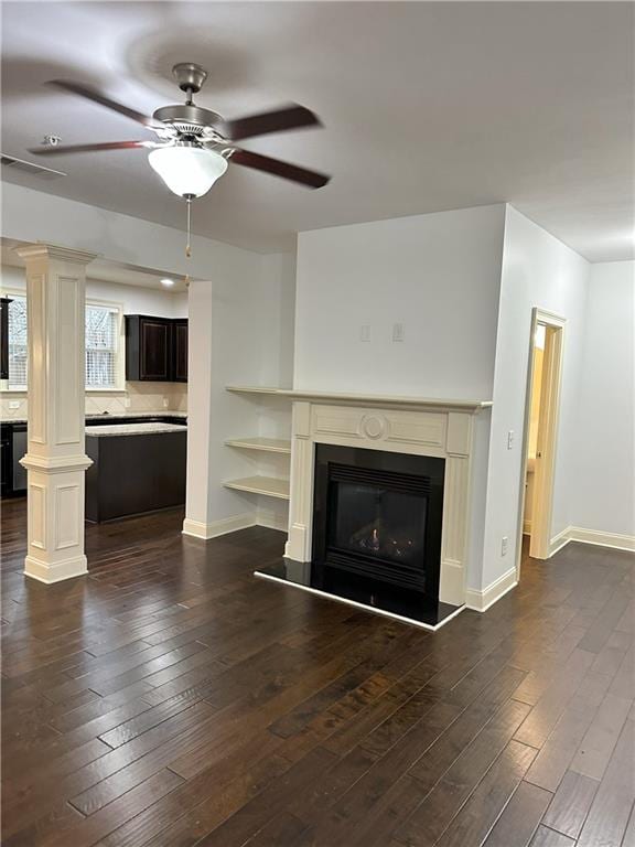 unfurnished living room with ceiling fan and dark hardwood / wood-style floors