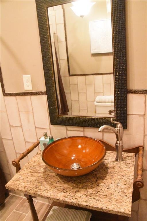 details featuring vanity and wainscoting