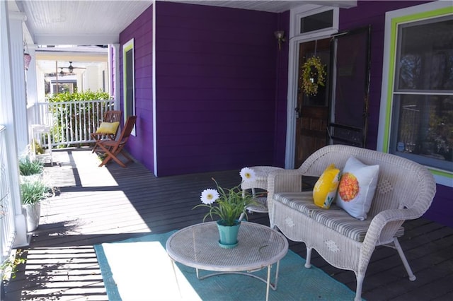 wooden terrace featuring covered porch