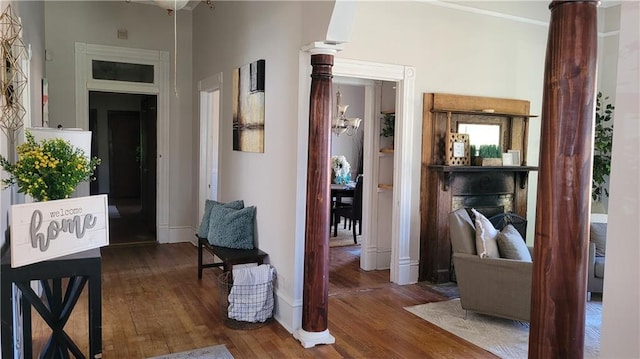 corridor with baseboards and wood finished floors