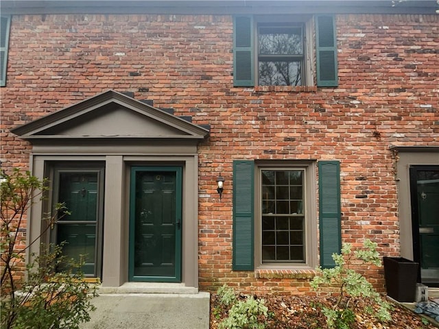 entrance to property with brick siding