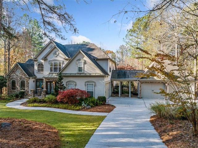 view of front of house featuring a garage and a front lawn