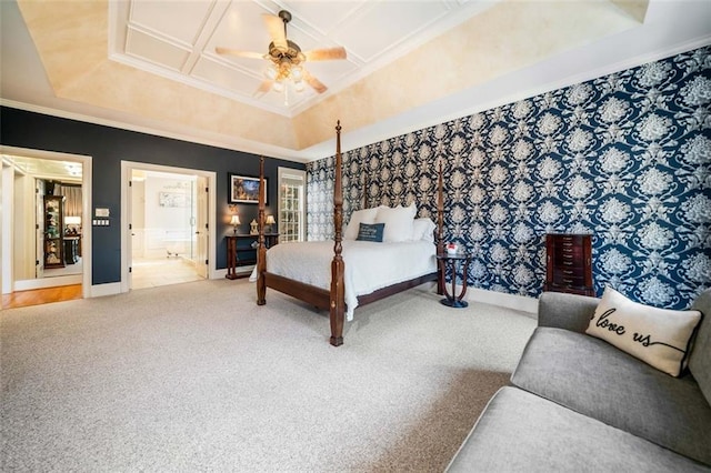 carpeted bedroom featuring ensuite bath, ceiling fan, coffered ceiling, and crown molding