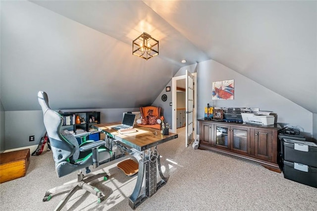 office space with lofted ceiling and light carpet