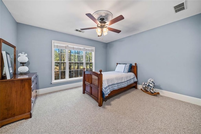 bedroom with light carpet and ceiling fan