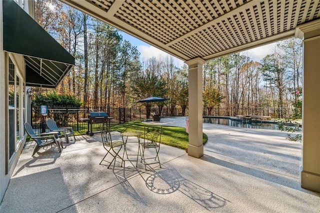 view of patio with a fenced in pool