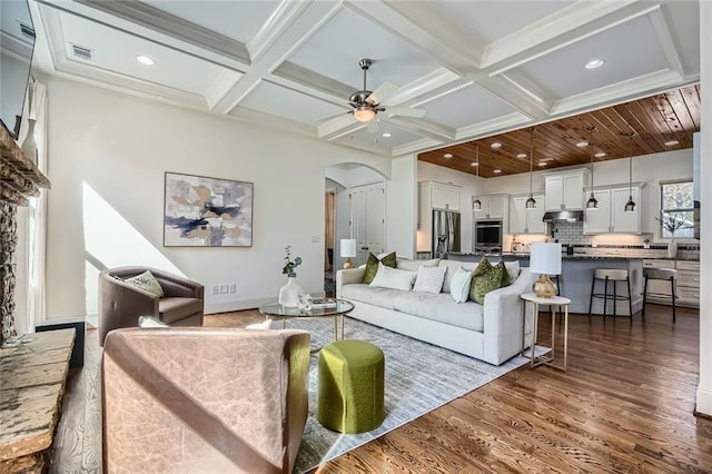 2987 Jefferson St, Atlanta, GA 30341 - living room featuring arched walkways, dark wood-style flooring, a ceiling fan, beamed ceiling, and coffered ceiling