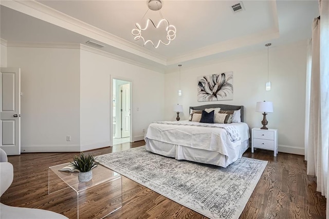 2987 Jefferson St, Atlanta, GA 30341 - bedroom with baseboards, a tray ceiling, crown molding, dark wood finished floors, and a chandelier