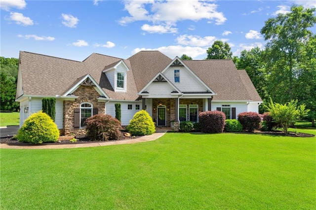 119 Sharp Mountain Crk, Ball Ground, GA 30107 - craftsman house featuring stone siding, a front yard, and a shingled roof