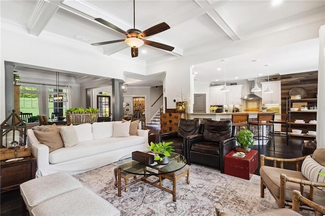 119 Sharp Mountain Crk, Ball Ground, GA 30107 - living room featuring coffered ceiling, ceiling fan, beamed ceiling, stairs, and ornamental molding