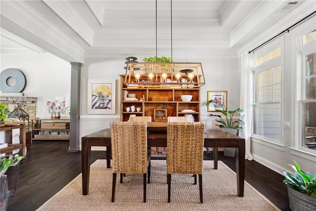 119 Sharp Mountain Crk, Ball Ground, GA 30107 - dining space featuring a raised ceiling, dark wood-type flooring, crown molding, and ornate columns
