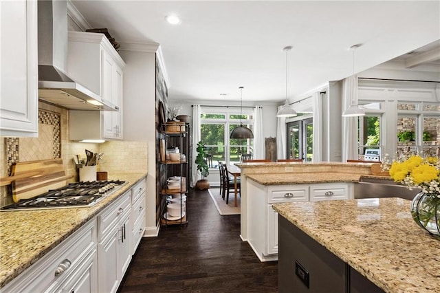 119 Sharp Mountain Crk, Ball Ground, GA 30107 - kitchen with wall chimney exhaust hood, stainless steel gas cooktop, dark wood finished floors, decorative backsplash, and recessed lighting