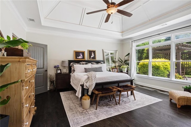 119 Sharp Mountain Crk, Ball Ground, GA 30107 - bedroom with crown molding, dark wood-style flooring, a tray ceiling, and a ceiling fan