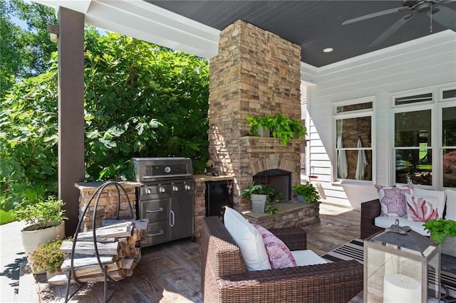 119 Sharp Mountain Crk, Ball Ground, GA 30107 - view of patio / terrace featuring a ceiling fan, a grill, and an outdoor living space with a fireplace