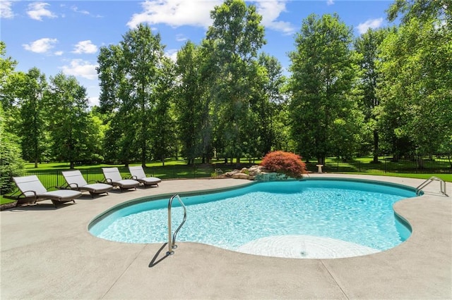 119 Sharp Mountain Crk, Ball Ground, GA 30107 - swimming pool featuring a patio and view of wooded area